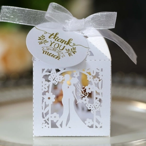 Laser cut white wedding candy gift box with gold Thank You tag and silk bow detail