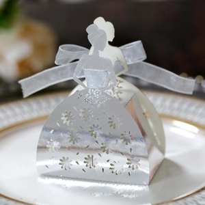 Elegant laser-cut silver bridal gown candy box with floral patterns and a white ribbon bow