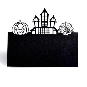 Detailed laser-cut Halloween place card featuring a haunted castle and pumpkin design