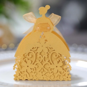 Detailed laser-cut gold bridal silhouette candy box with floral patterns and organza bow