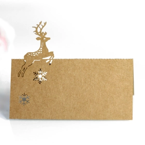 Laser cut kraft paper reindeer and snowflake place card for Christmas and wedding tables