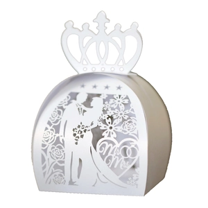 Detail of laser-cut wedding candy box with Mr & Mrs silhouette and crown top