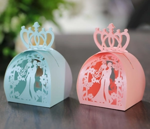 Detailed laser-cut wedding candy boxes with crown top and couple silhouettes