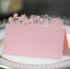 Pink laser-cut sunflower place cards made of premium pearlescent paper for table decor