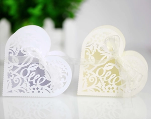 Detailed laser-cut heart candy box with Love motif and white silk ribbon for weddings