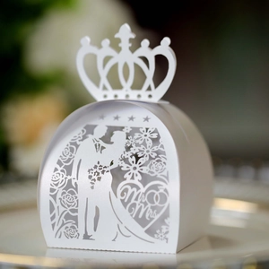 Detailed laser cut white wedding candy box featuring crown top and Mr & Mrs heart patterns