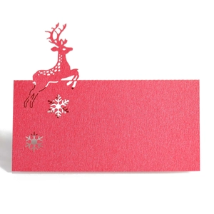 Detailed laser-cut red reindeer and snowflake place card for Christmas table decor