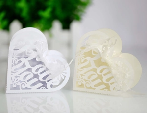 Detailed laser-cut heart candy box with Love You pattern and elegant ribbon for weddings