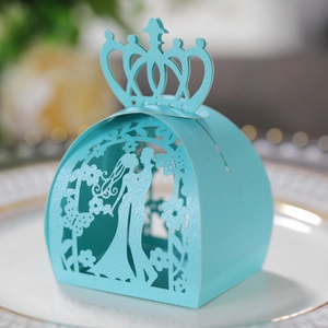 Blue laser cut pumpkin carriage wedding favor box with crown and couple silhouette