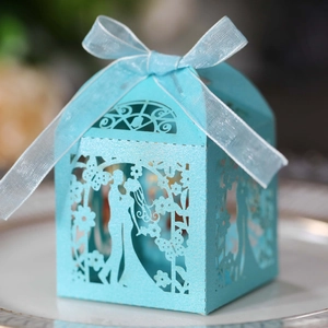 Sky blue laser-cut wedding favor box with romantic silhouette and ribbon bow