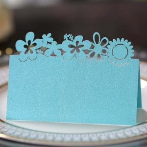 Elegant laser cut sunflower place card in light blue pearlescent paper for wedding decor