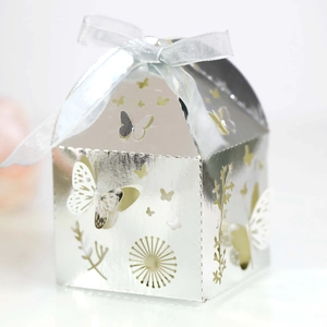 Detail of silver laser-cut butterfly gift box with elegant blue satin ribbon