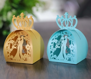Laser cut wedding favor boxes with groom and bride silhouette and crown handle detail
