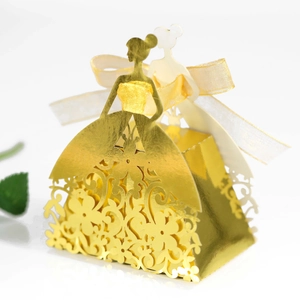 Detail of laser-cut hollow dress-shaped wedding favor box with a satin ribbon bow