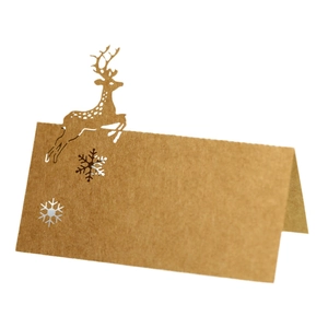 Laser cut reindeer and snowflake Christmas brown kraft paper place cards for table seating