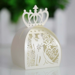 Detailed laser-cut ivory wedding favor box with Mr & Mrs bride and groom crown design
