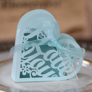 Detail of light blue heart laser-cut candy box with Thank You text and ribbon