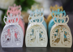Detailed laser-cut wedding favor boxes with crown top and elegant couple silhouette