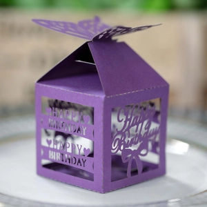 Detail of purple laser-cut birthday candy box with elegant butterfly top and hollow text
