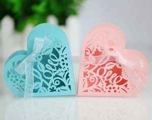 Laser-cut LOVE heart candy boxes with ribbon bows for weddings in pink and blue
