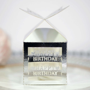 Detail of silver laser-cut birthday favor box with hollow butterfly design and engraving