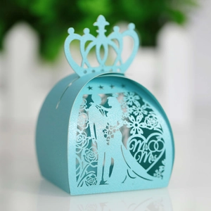 Laser-cut light blue wedding favor box with crown top and Mr & Mrs heart pattern
