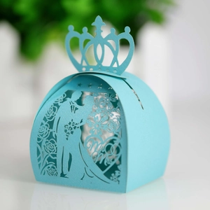 Detail of light blue laser-cut wedding candy box with Mr & Mrs groom bride silhouette
