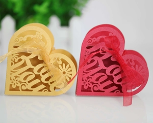Detail of heart-shaped hollow gift boxes with Thank You laser cut design and ribbon
