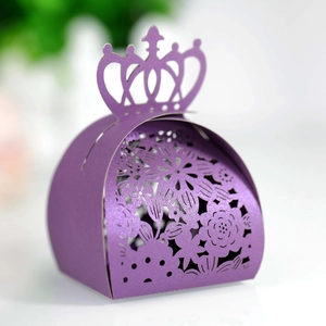 Detail of purple crown-shaped candy box with laser-cut floral patterns and pearlescent finish