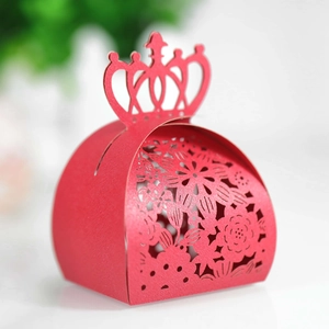 Detailed laser-cut hollow pattern on red crown candy gift box with floral textures