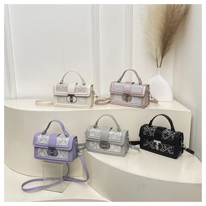 Detail view of stylish square shoulder bags in five colors with geometric textures
