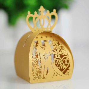 Detail of laser-cut wedding candy box with Mr & Mrs heart pattern and crown top