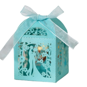 Sky blue laser-cut wedding candy box with couple silhouette and elegant ribbon bow
