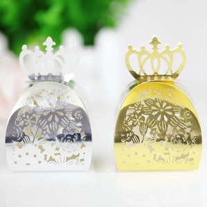 Macro detail of laser cut crown candy boxes in metallic gold and silver finish