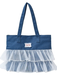 Blue denim tote bag with white lace ruffles and Fashion Bag text on white background