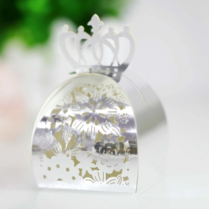 Detailed laser-cut candy box with elegant crown top and intricate floral patterns