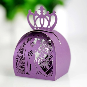 Detail of purple laser-cut wedding candy box with Mr & Mrs silhouette and crown