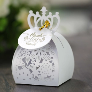 Detail of laser-cut crown candy box with white pearlescent finish and Thank You tag