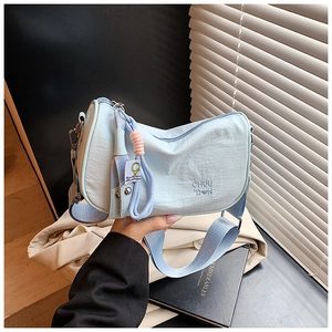 Light blue nylon crescent bag with letter embroidery and wide shoulder strap