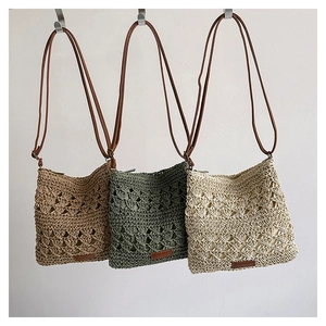 Detailed woven texture of hollow diamond pattern straw bags with leather straps