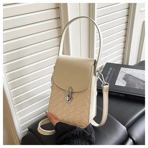 Detail of cream small crossbody bag featuring woven texture and silver twist lock closure