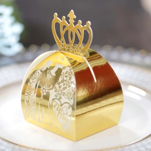 Detailed laser cut crown candy box featuring Mr & Mrs silhouettes on a white dinner plate