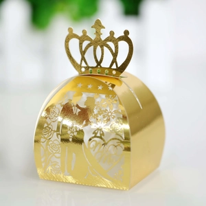 Detailed laser-cut wedding favor box with bride and groom silhouette and golden crown