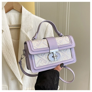 Close-up of lavender square bag with geometric floral jacquard and silver twist lock