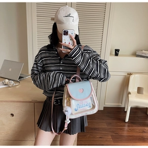 Detail view of cute heart-shaped transparent window and embroidery on the ita bag