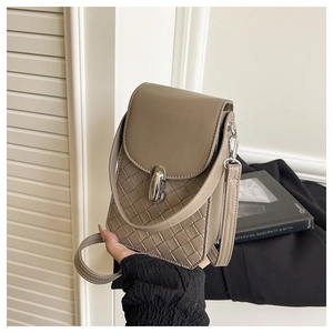 Detail of taupe woven leather mini bag with silver metal swivel clasp and adjustable strap