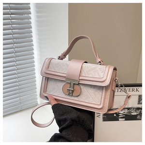 Detail view of pink leather and geometric jacquard fabric shoulder bag with silver lock