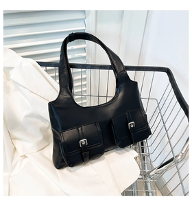 Detail of black faux leather underarm bag featuring dual cargo pockets with silver buckles