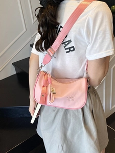Chic pink nylon crossbody bag for women with wide shoulder strap and CHUU DN logo