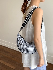 Minimalist black and white gingham half-moon canvas crossbody bag with striped strap